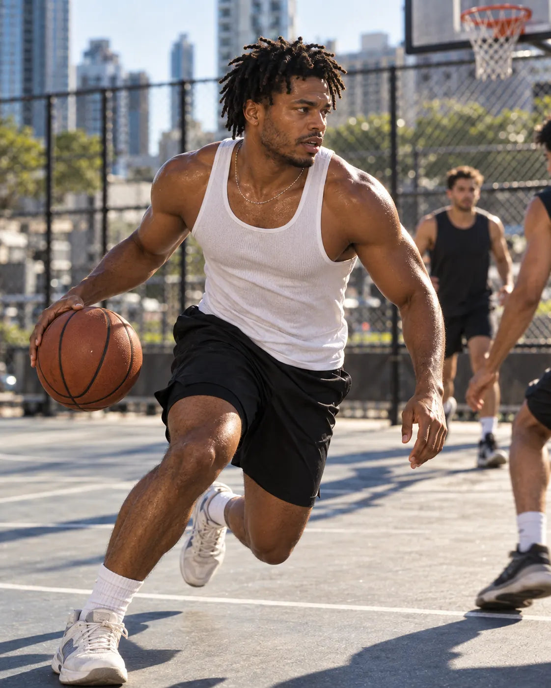 A man playing basketball outdoors